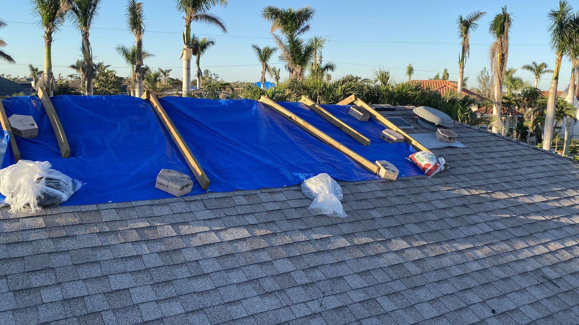 Professional roofing contractor documenting storm damage for insurance claim assistance in Denver