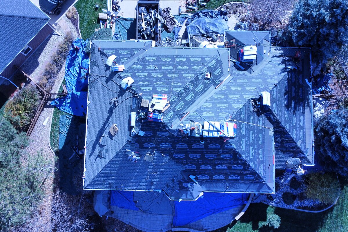 Professional residential roofing services - Aerial view of quality roof installation work by Spencer Roofing in Denver